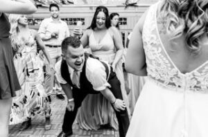 groom dancing with guests